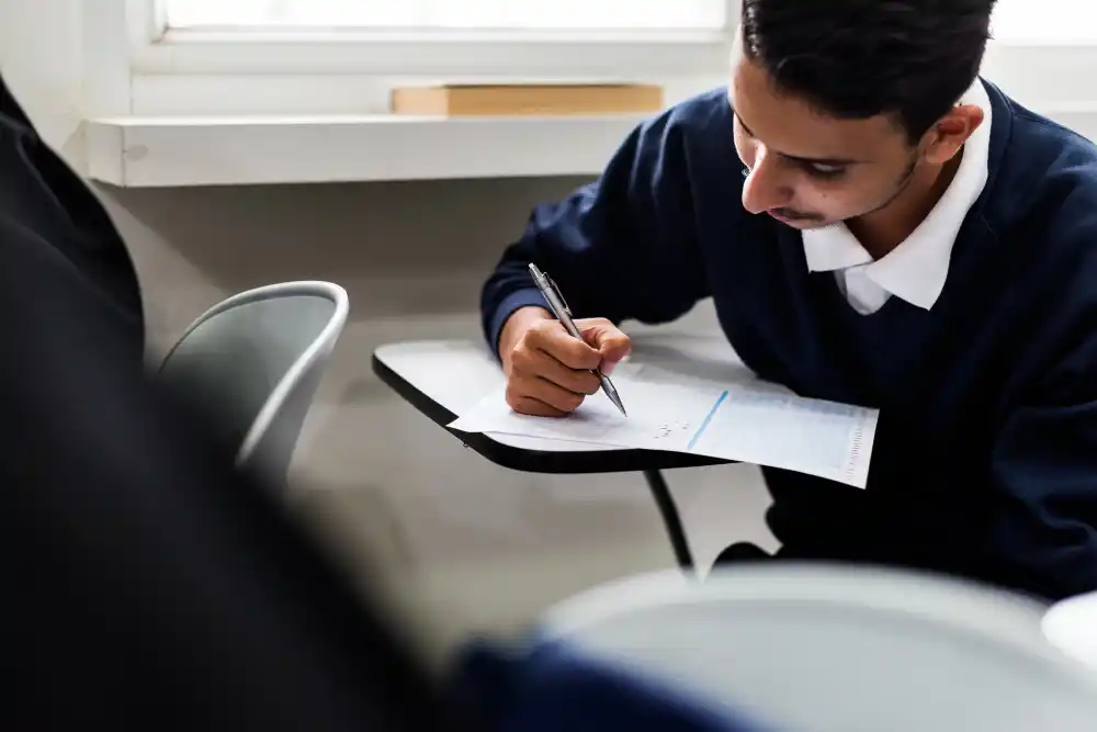 Pakistani FSc student reviewing admission documents and transcripts for an aircraft maintenance engineering course