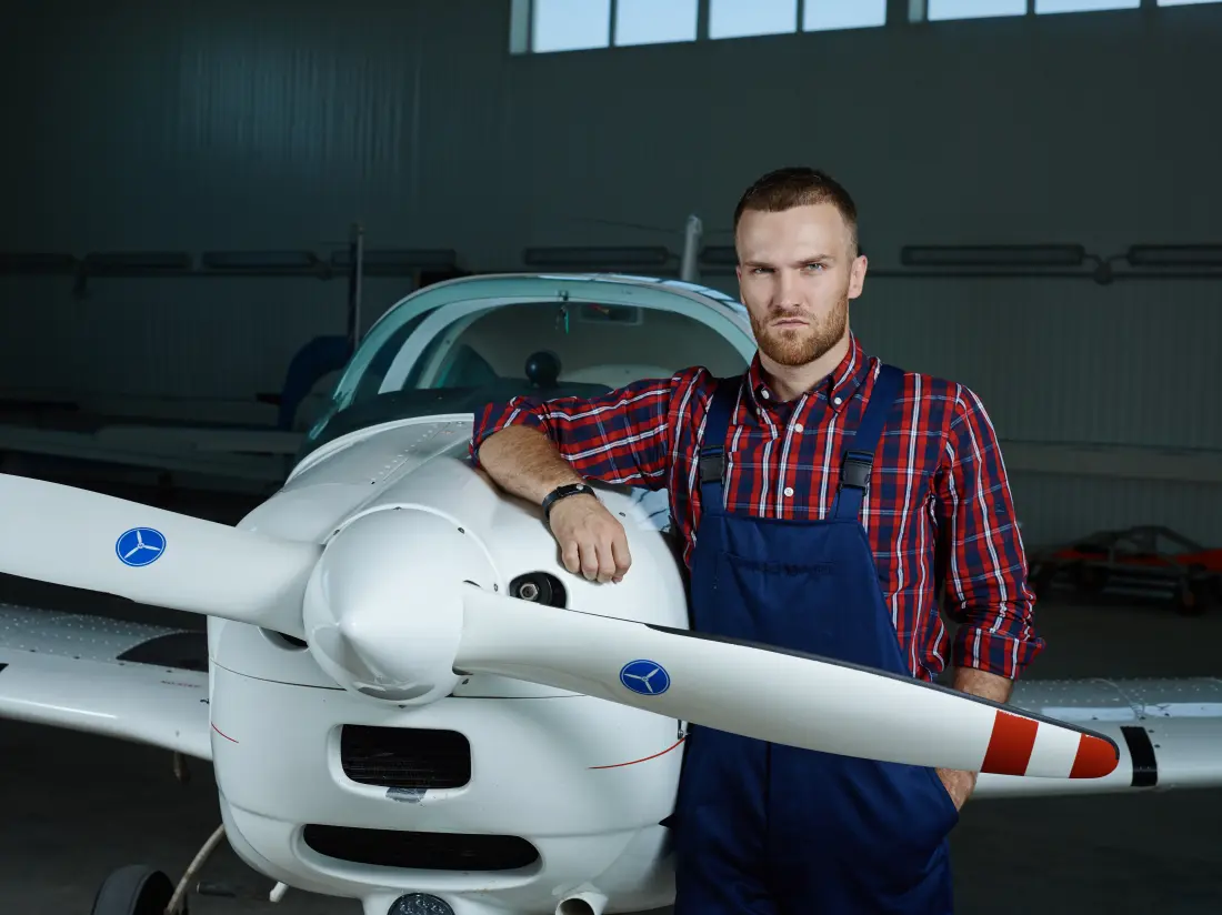 Aircraft maintenance engineering work on a jetliner, representing the AME vs pilot career comparison
