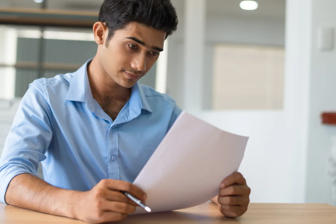Pakistani aircraft maintenance engineer reviewing AME license and certification documents