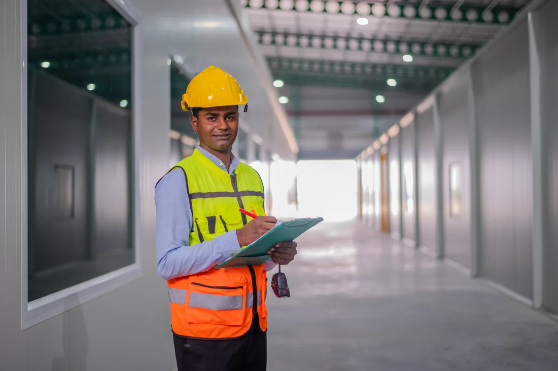 Pakistani PCAA-licensed aircraft maintenance engineer inspecting a commercial aircraft in a hangar