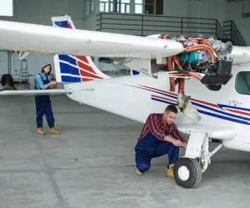 Aviation students during hands-on hangar training at an aircraft maintenance programme