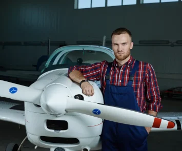 Aircraft maintenance engineering work on a jetliner, representing the AME vs pilot career comparison